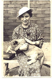 [ Woman holding lioncub]